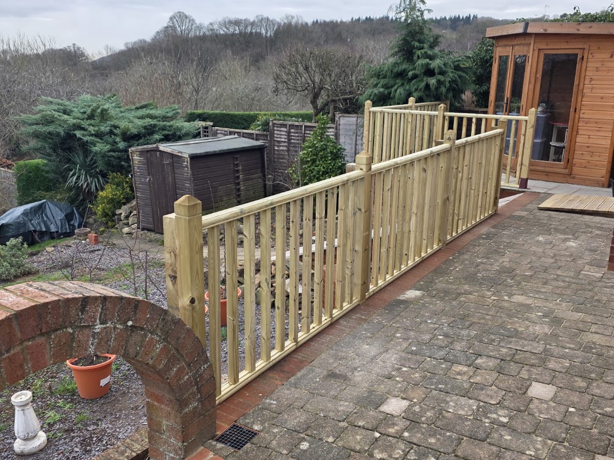 A run of spindle balustrade across a garden patio